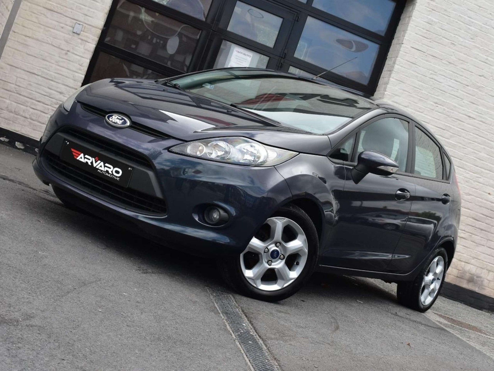 Ford Fiesta 1.25i Titanium / Airco / PDC / Verw Zetels / Car, Auto's, Voorwielaandrijving, Euro 5, Stof, Gebruikt