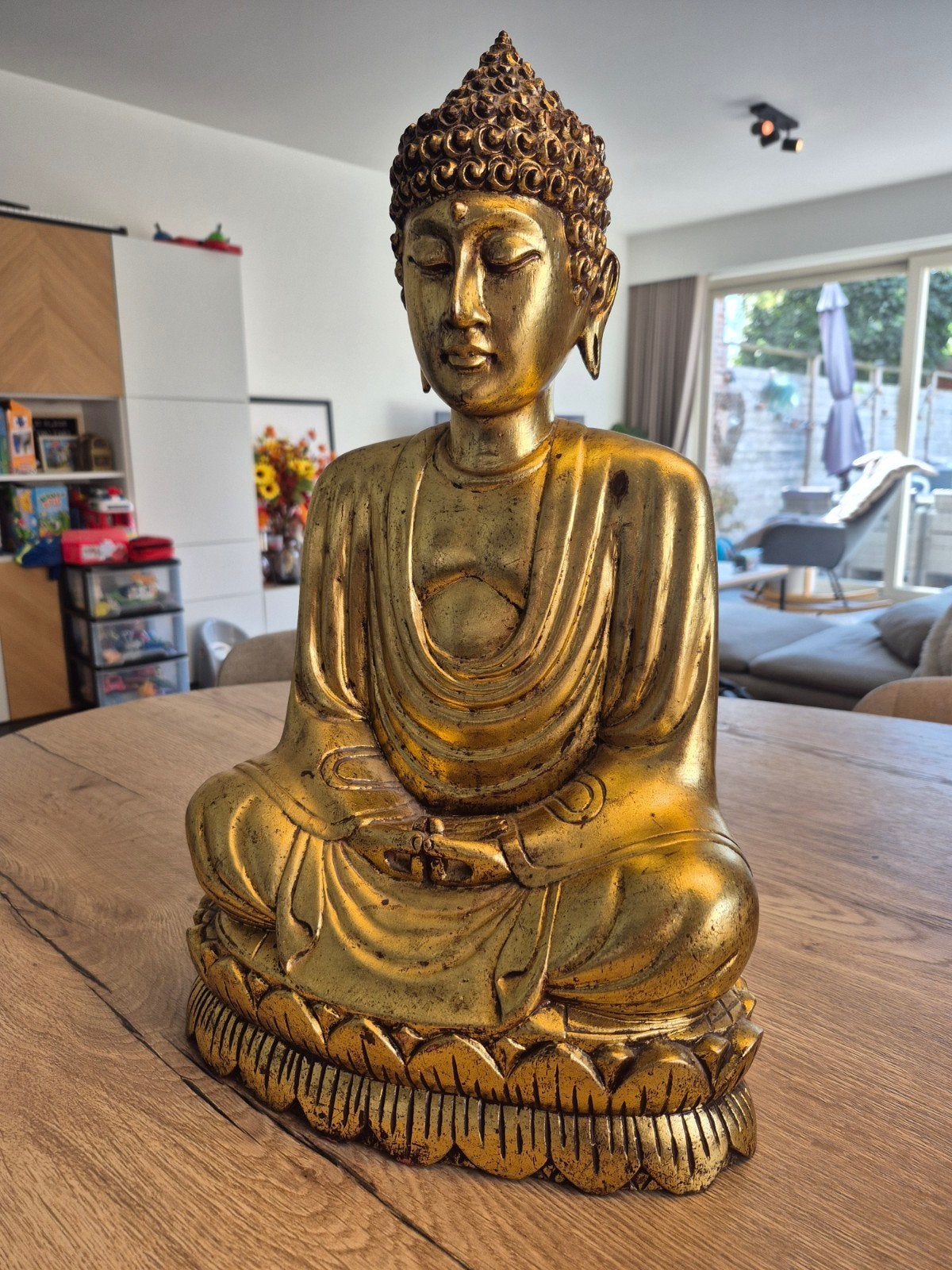 gouden buddha beeld, Ophalen