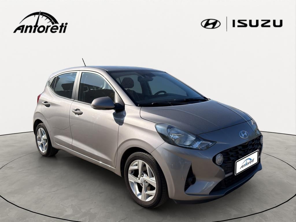 Hyundai i10 1.0i Twist Techno Pack, Stof, https://public.car-pass.be/vhr/39bd675b-cd76-40be-9a5e-8b7d53b60380, Beige, 5 zetels