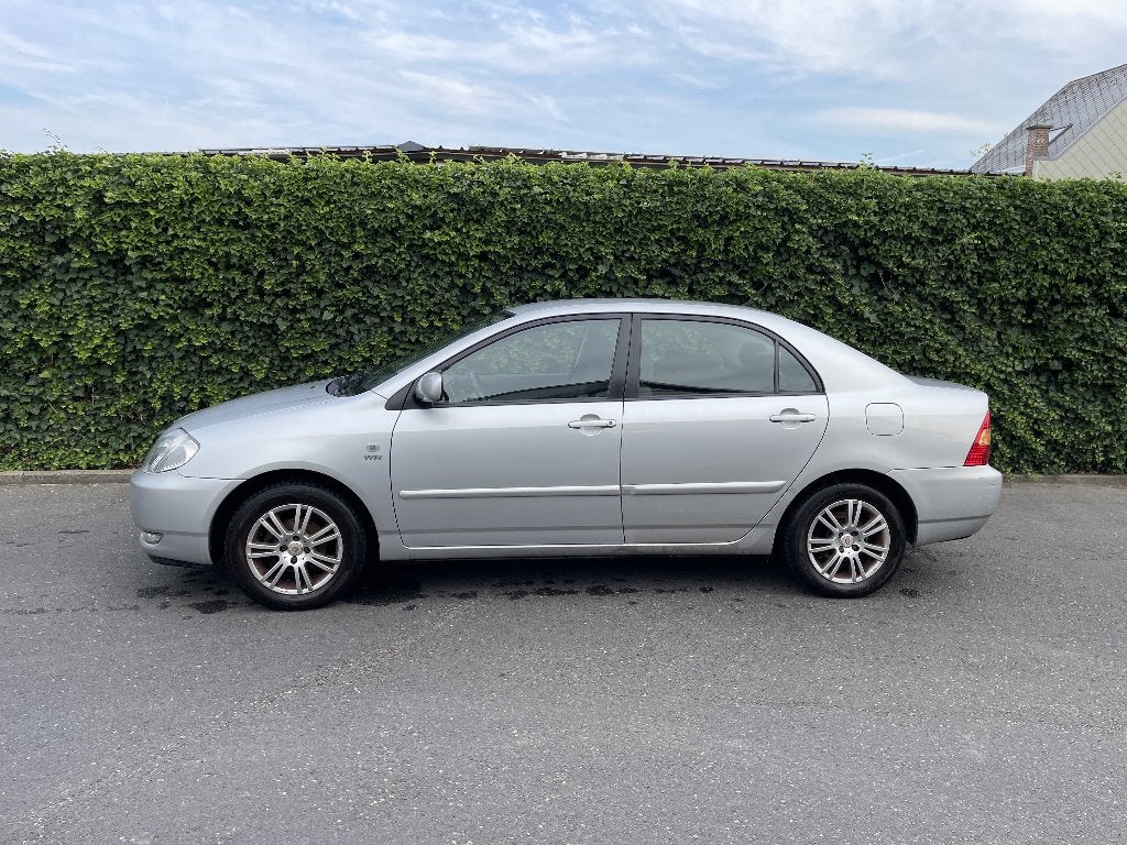 Toyota Corolla, Bouwjaar 2003, Km: 217.000, Voorwielaandrijving, 4 deurs, Stof, Zwart