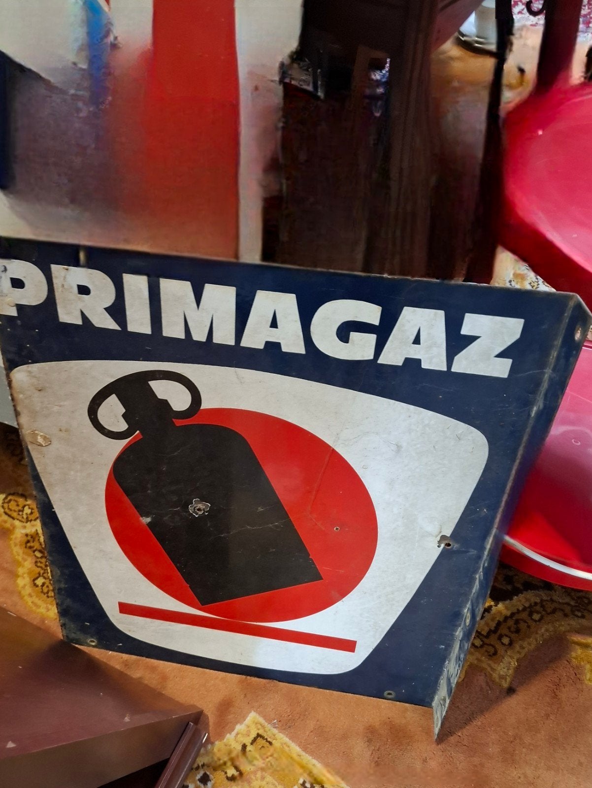 Een oude dubbelzijdige reclame van Primagaz, Ophalen, Gebruikt