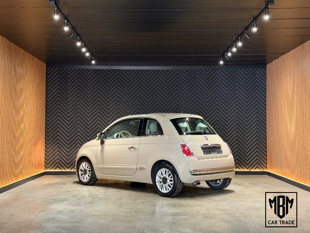 ✅Fiat 500 1.2i Lounge 12 Maanden GARANTIE Pano Airco Parksen, Auto's, Voorwielaandrijving, Stof, 4 cilinders, Beige