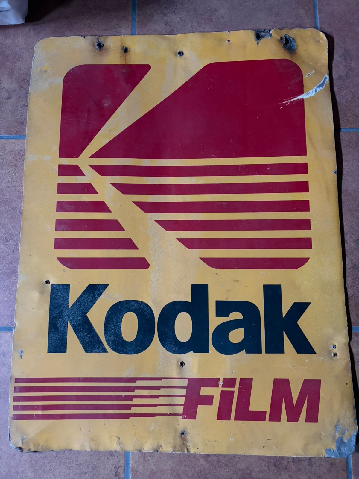 Plaque publicitaire Kodak film pas émaillée (66cm/50cm)., Ophalen, Gebruikt, Reclamebord