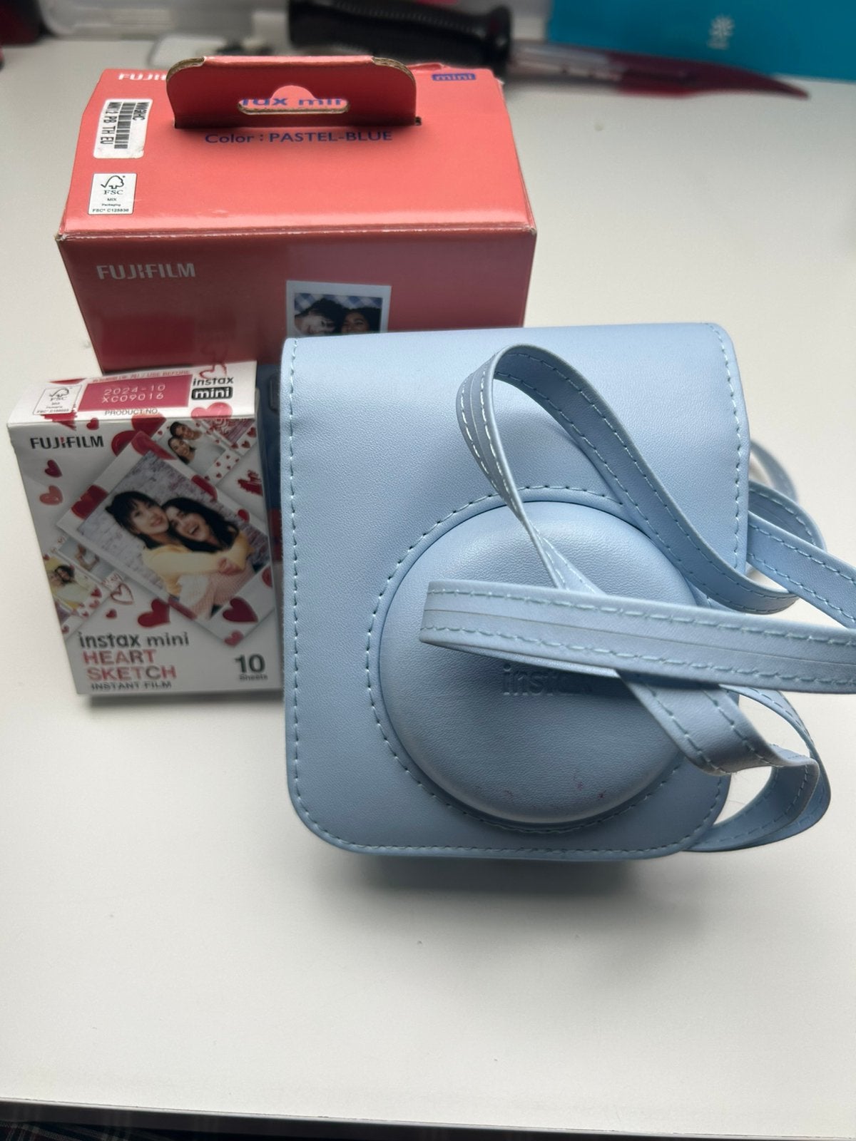 Instax mini 12 couleur bleu clair en parfait état., Enlèvement, Comme neuf