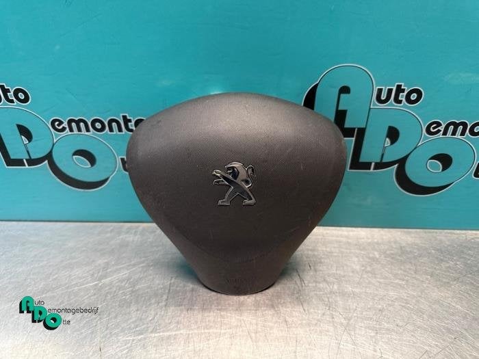 Airbag gauche (volant) d'un Peugeot 107 (107 05-), -, 3 mois de garantie, Utilisé, -