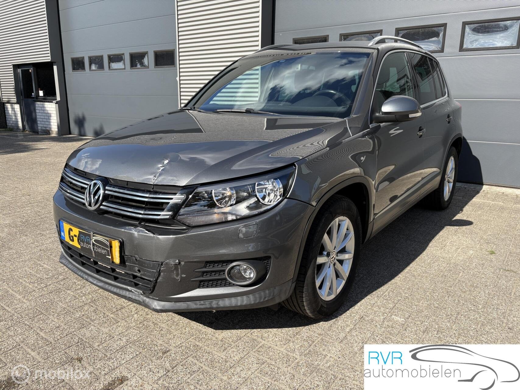 Volkswagen Tiguan 1.4 TSI Sport&Style AUTOMAAT/CRUISE/NAVI, Auto's, Stof, Gebruikt, 4 cilinders, 1451 kg