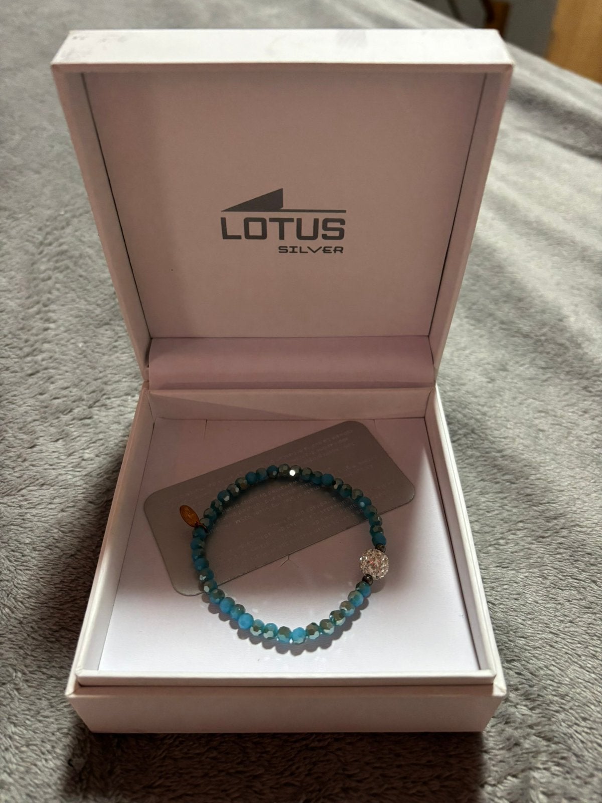 Bracelet lotus, Enlèvement ou Envoi, Comme neuf, Autres couleurs