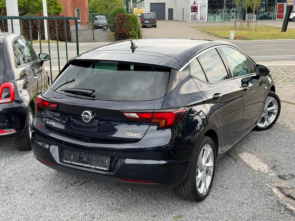 Opel Astra 1.4 Turbo Innovation – Navi – Camera – Cruise, Auto's, Voorwielaandrijving, 4 cilinders, Blauw, Leder en Stof