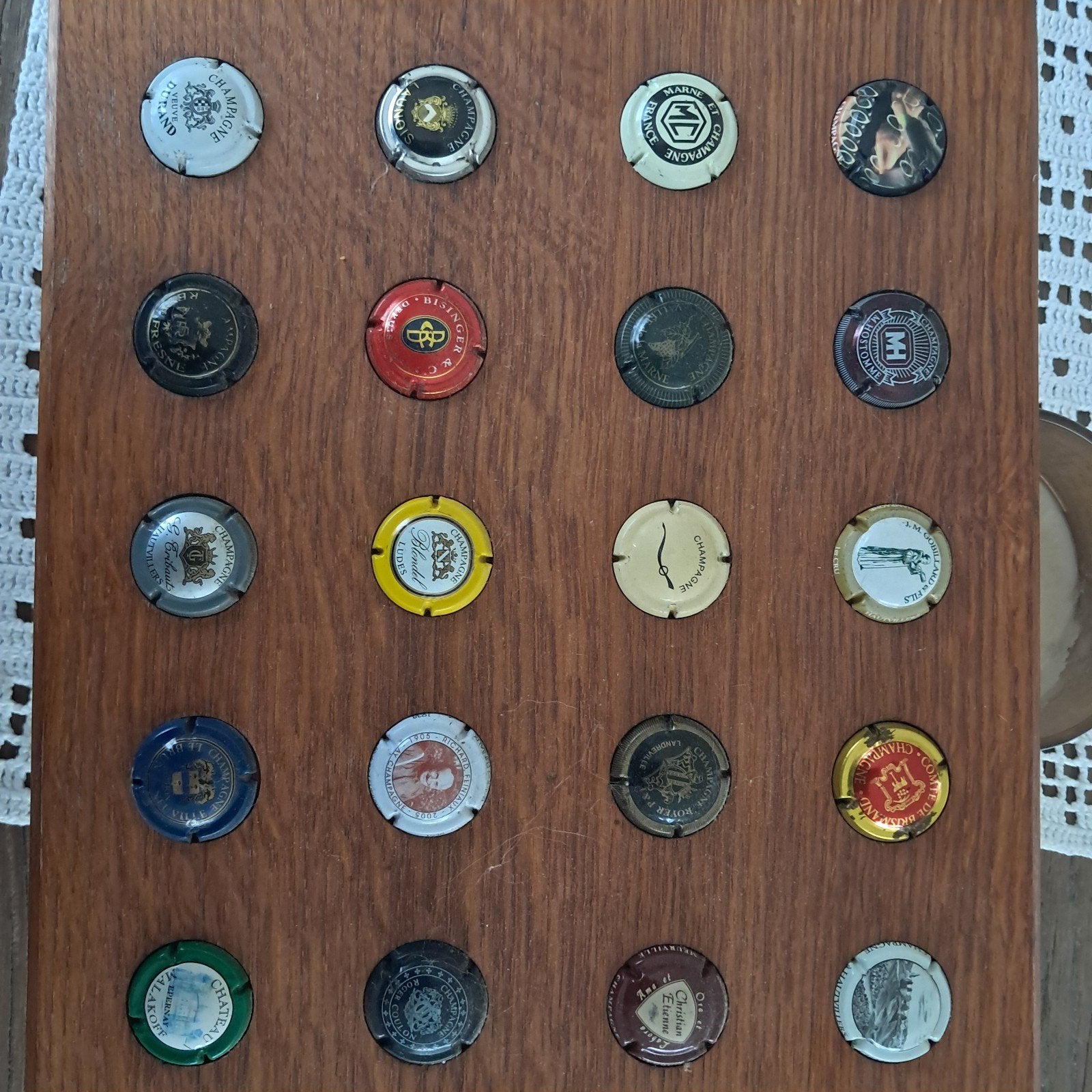 20 champagnecapsules in houder, Ophalen of Verzenden