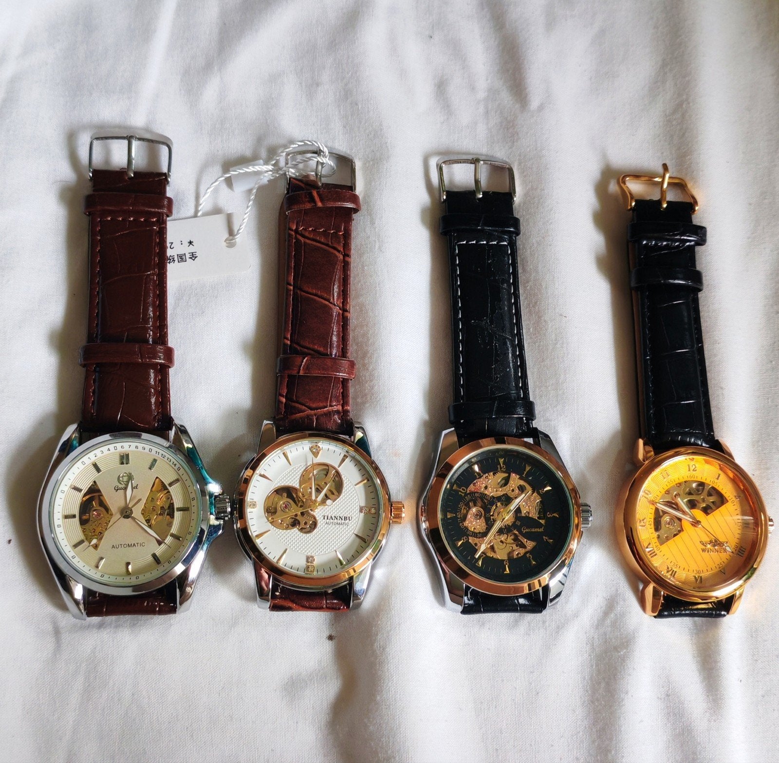 Lot de 4 montres homme automatiques – Mécanisme apparent – E, Envoi, Neuf, Noir