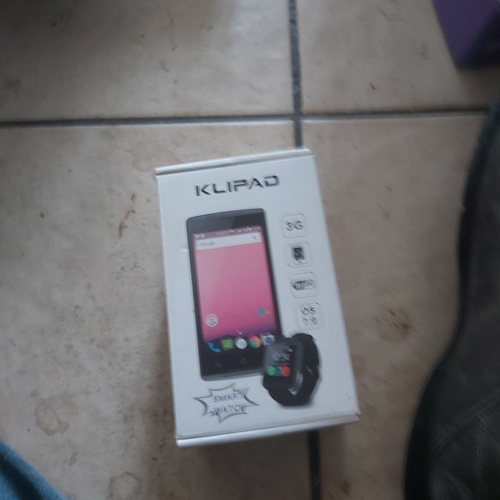 portable avec plus  montre  dans sa boîte, Ophalen
