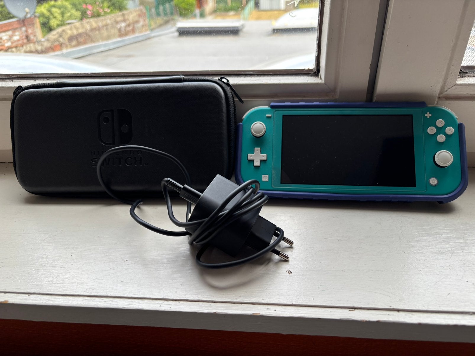 Nintendo Switch Lite bleue., Enlèvement ou Envoi, Turquoise, Utilisé, Avec housse de protection ou sac