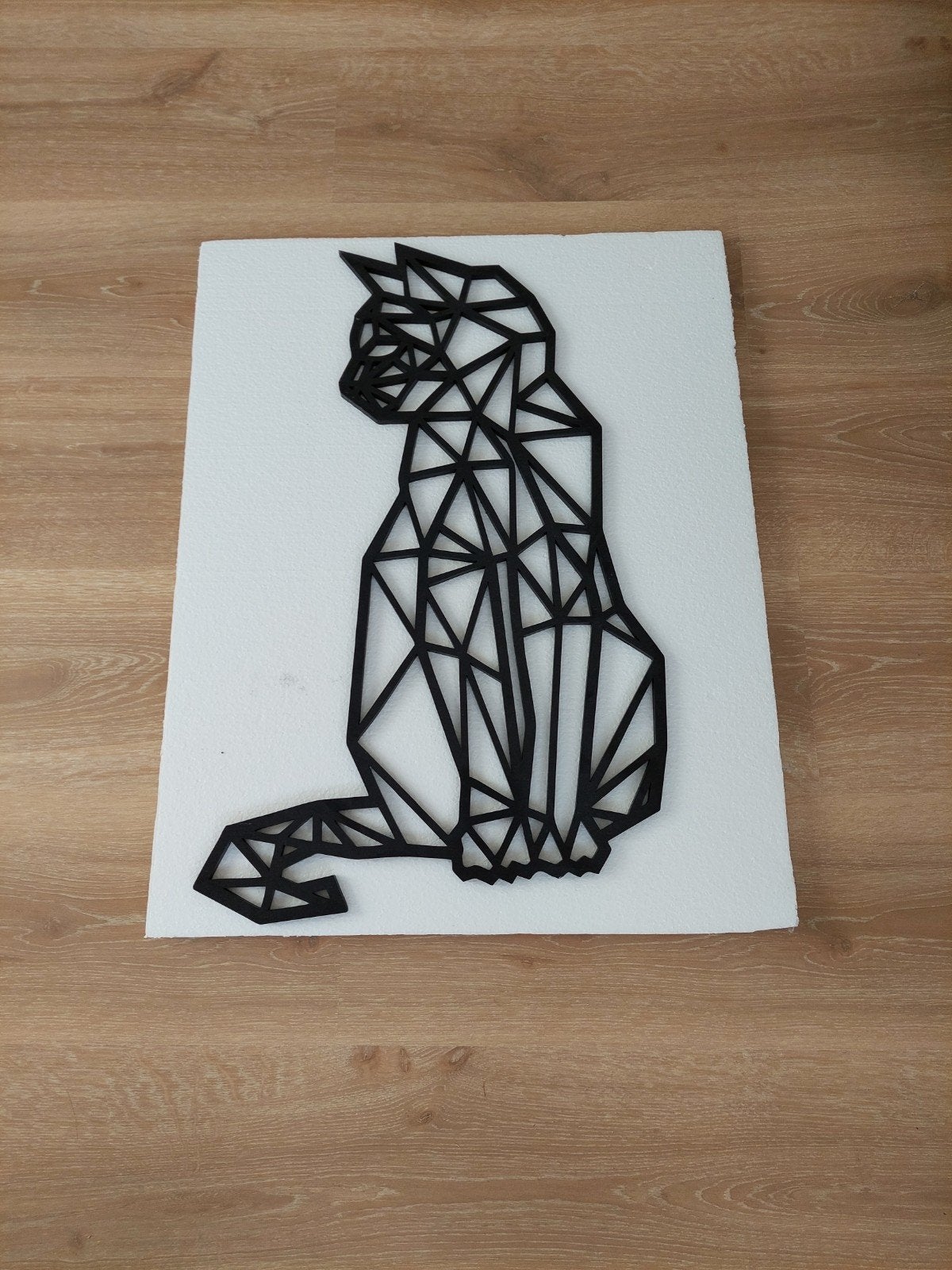 Geometrische houten wanddecoratie, Enlèvement