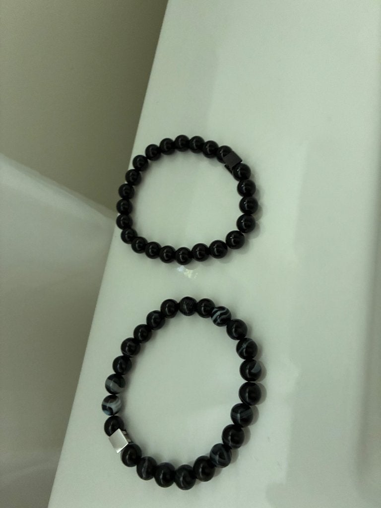 Gemini bandjes in aanbieding, Handtassen en Accessoires, Armbanden, Ophalen of Verzenden, Nieuw, Zwart, Overige materialen