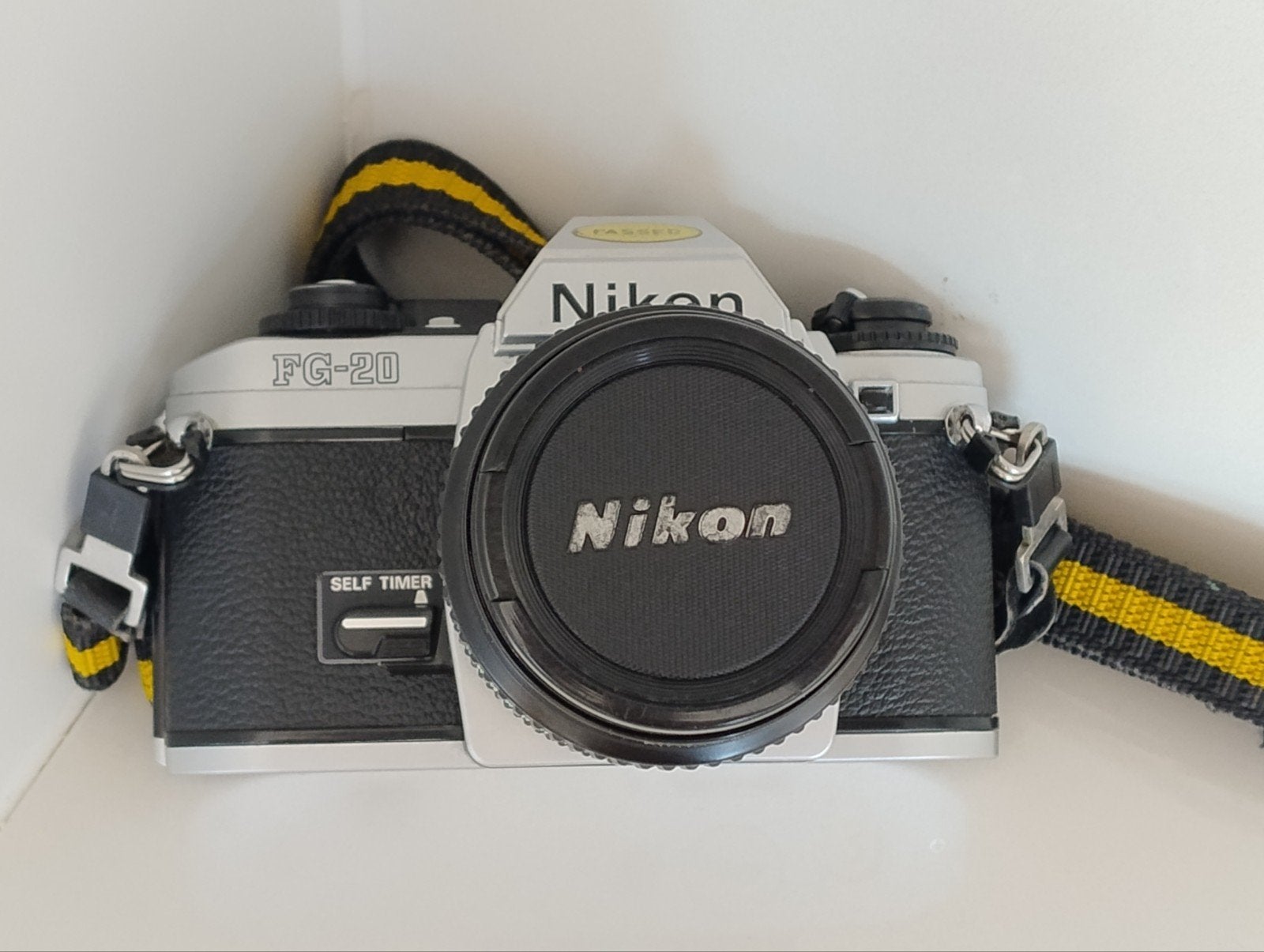 Nikon FG-20 Camera met een Micro Nikkor 55mm 1:2.8 lens+riem, Ophalen of Verzenden, Gebruikt, Spiegelreflex, Nikon