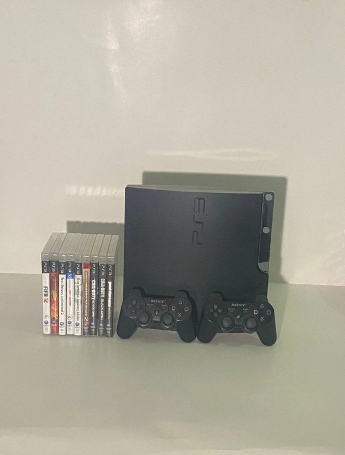 PlayStation 3 Slim 320GB + 8 Games + 2 Originele Controllers, Games en Spelcomputers, Spelcomputers | Sony PlayStation 3, Met games