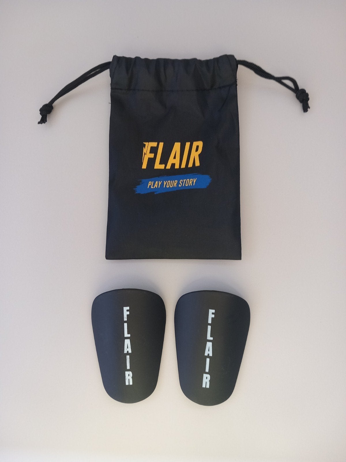 Flair scheenlappenjes, Sport en Fitness, Voetbal, Maat XS of kleiner, Ophalen of Verzenden, Zo goed als nieuw, Clubaccessoires