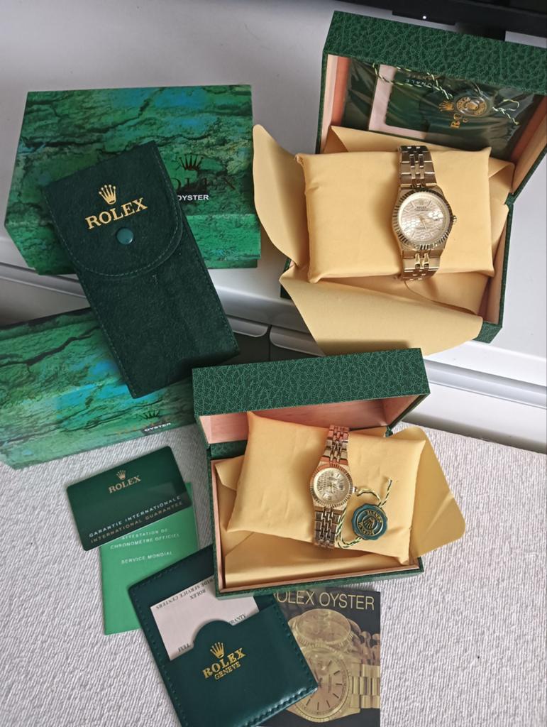 Horloge set Land Dweller R Dames en Heren met dozen, Handtassen en Accessoires, Horloges | Heren, Ophalen of Verzenden, Goud, Goud