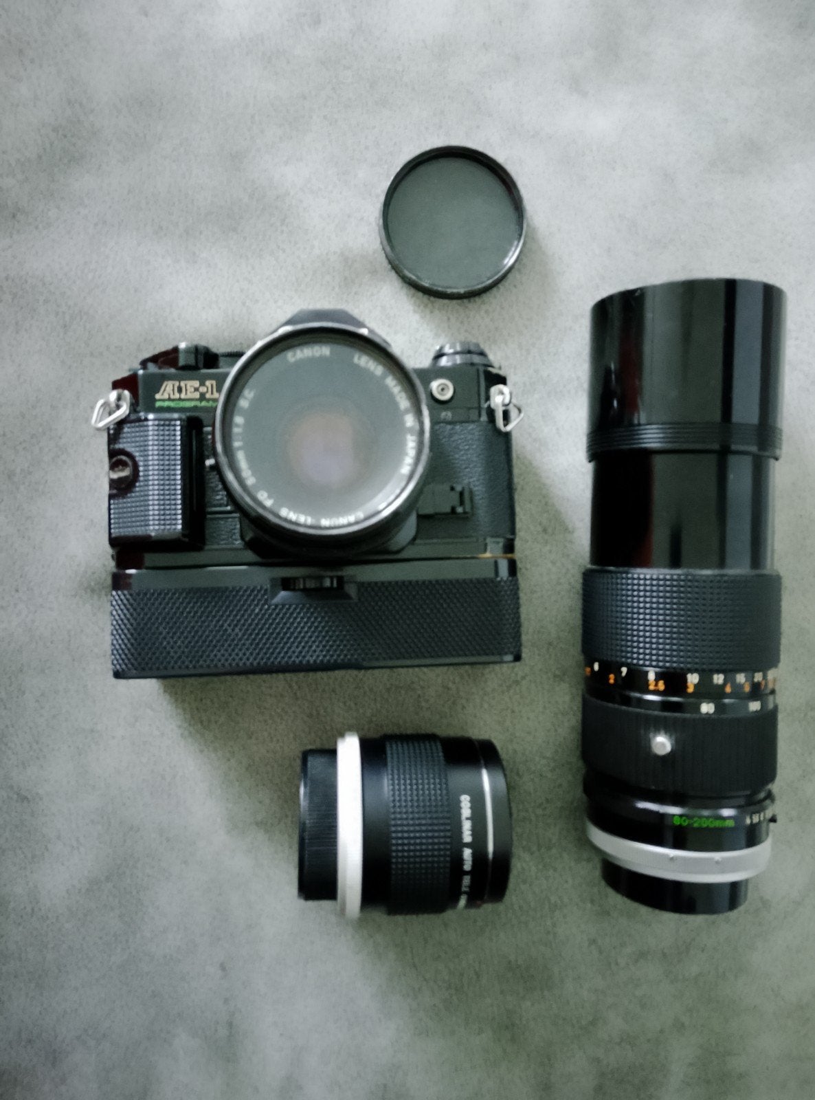 Canon AE1 Program, motor, 50mm en 80-200mm lenzen en fototas, Audio, Tv en Foto, Fotocamera's Analoog, Ophalen of Verzenden, Canon
