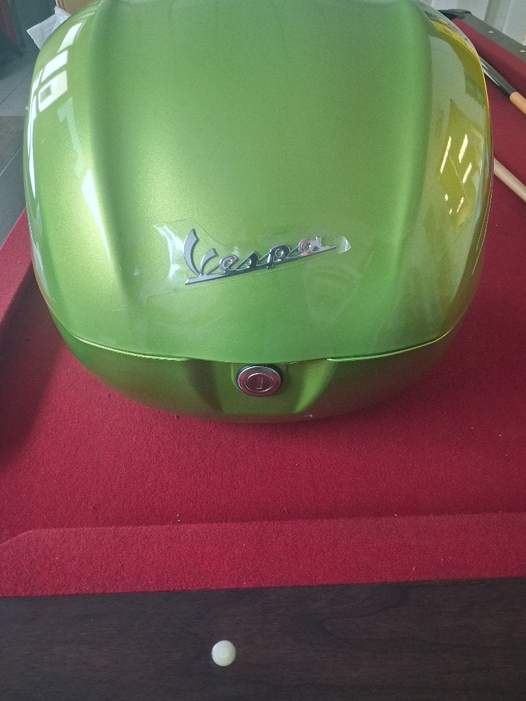 Topkoffer Vespa, Ophalen