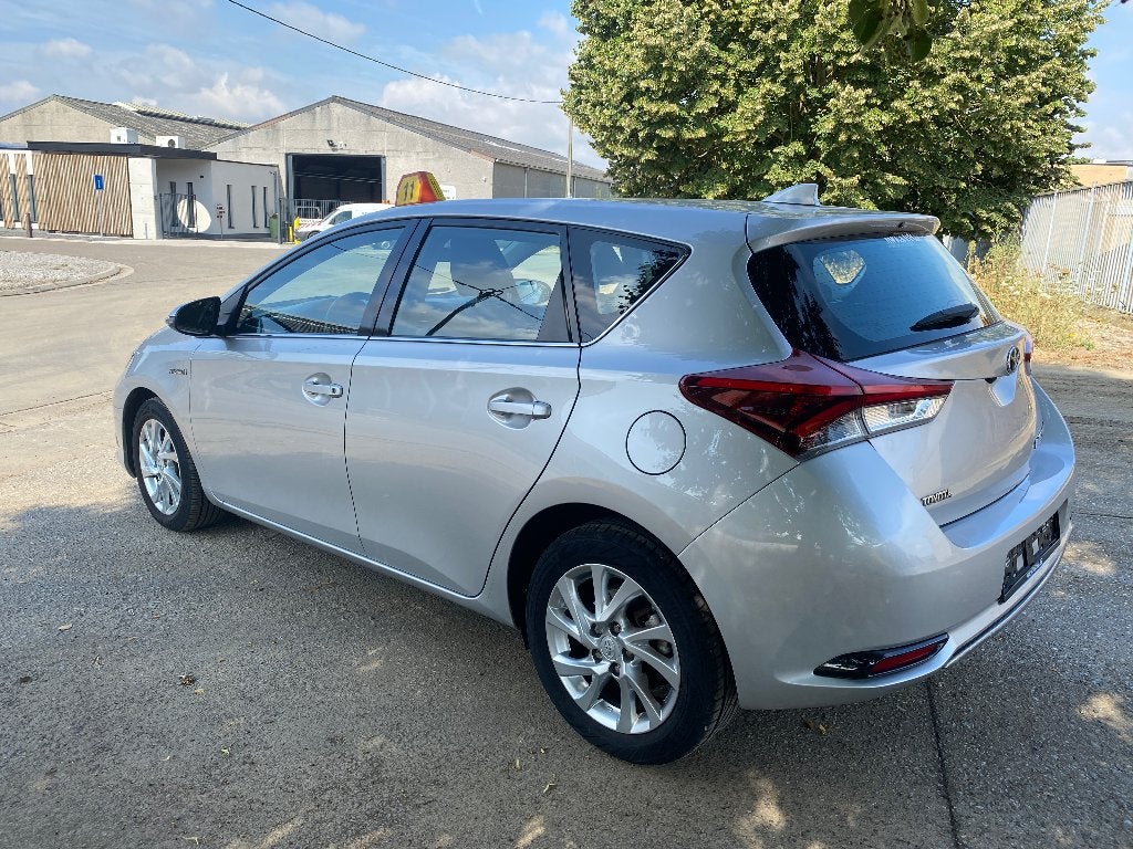 Toyota Auris HEV 1.8i HSD Dynamic E-CVT, Auto's, Dealer onderhouden, Stof, 4 cilinders, Bedrijf