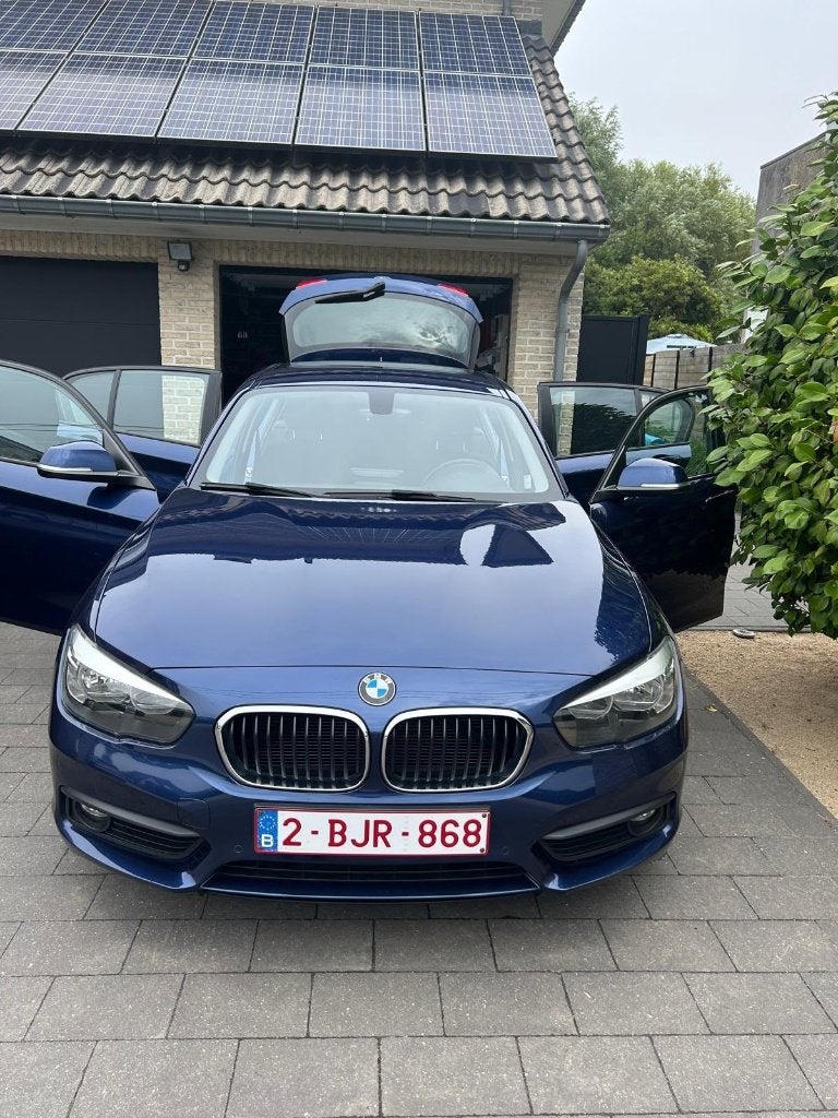 BMW 116i - 2018 - 106.265km, Auto's, BMW, 1305 kg, Zwart, 5 deurs, Particulier