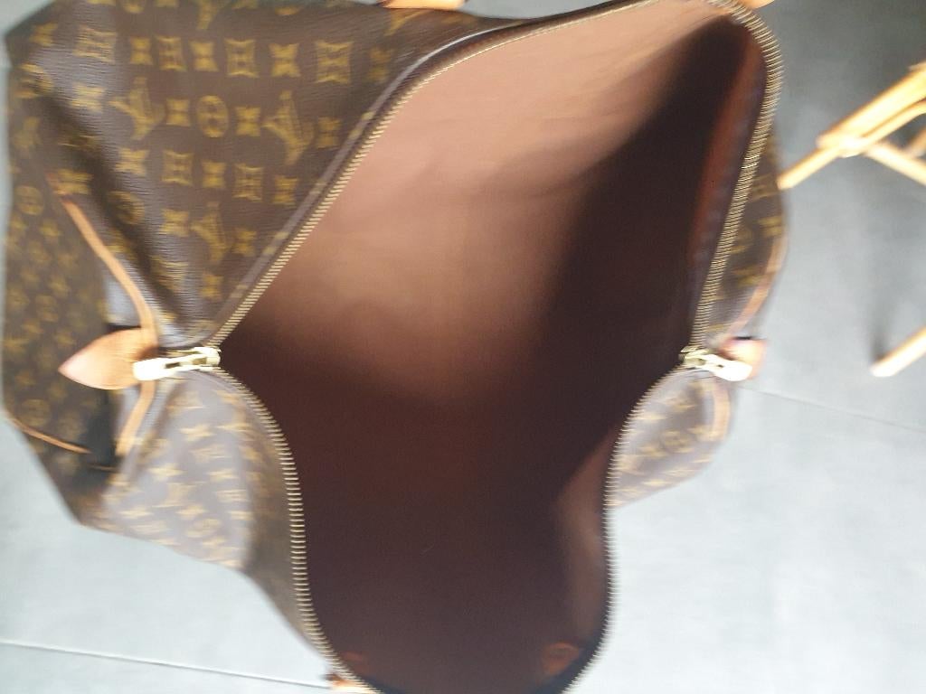 Louis Vuitton Keepall leather travel bag  Very good, Enlèvement ou Envoi, Comme neuf, Autres types