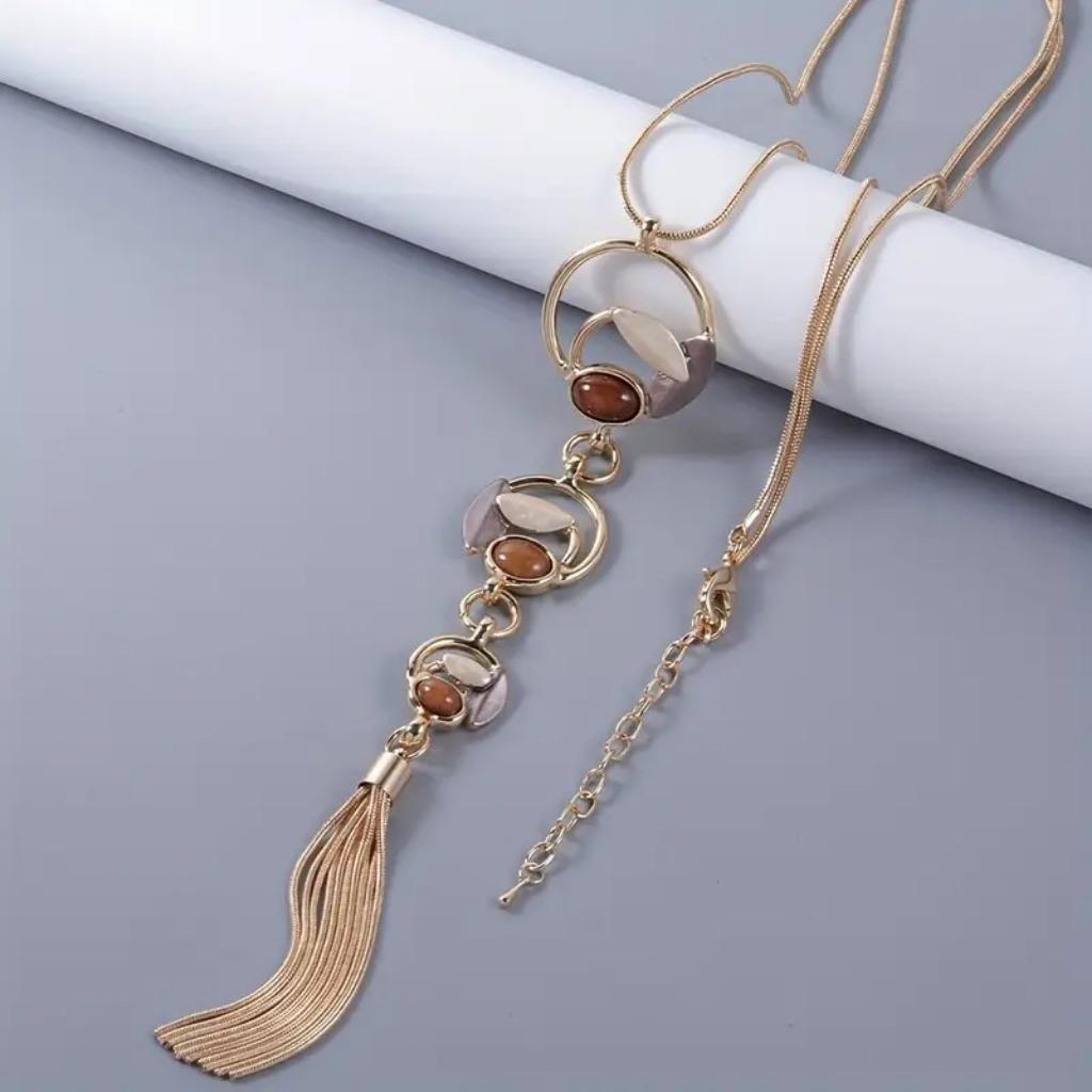 Collier long avec pendentif dans les tons marron doré, Neuf, Or, Autres matériaux, Avec pendentif