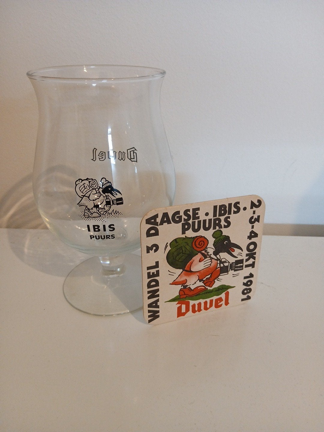 Duvel glas Ibis Puurs met bierviltje., Collections, Enlèvement ou Envoi, Neuf, Verre ou Verres, Duvel