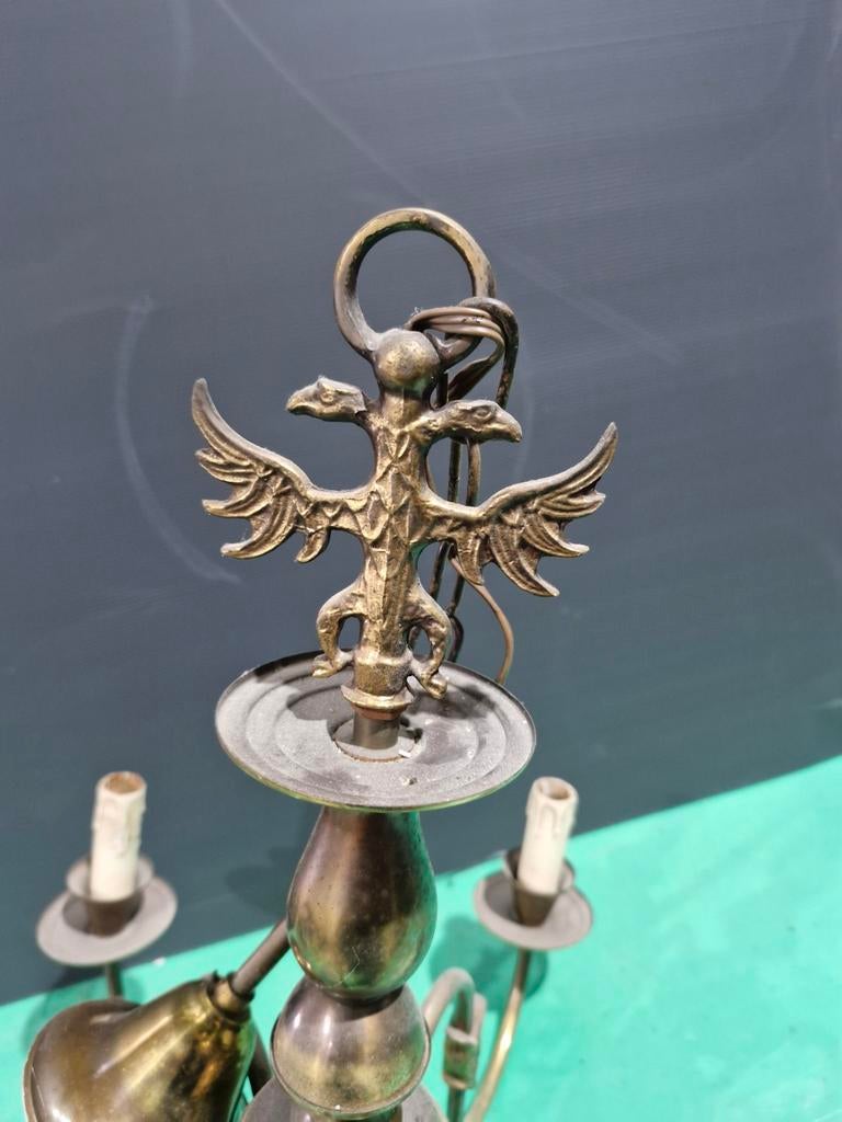 Lustre en cuivre avec aigle bicéphale, Enlèvement