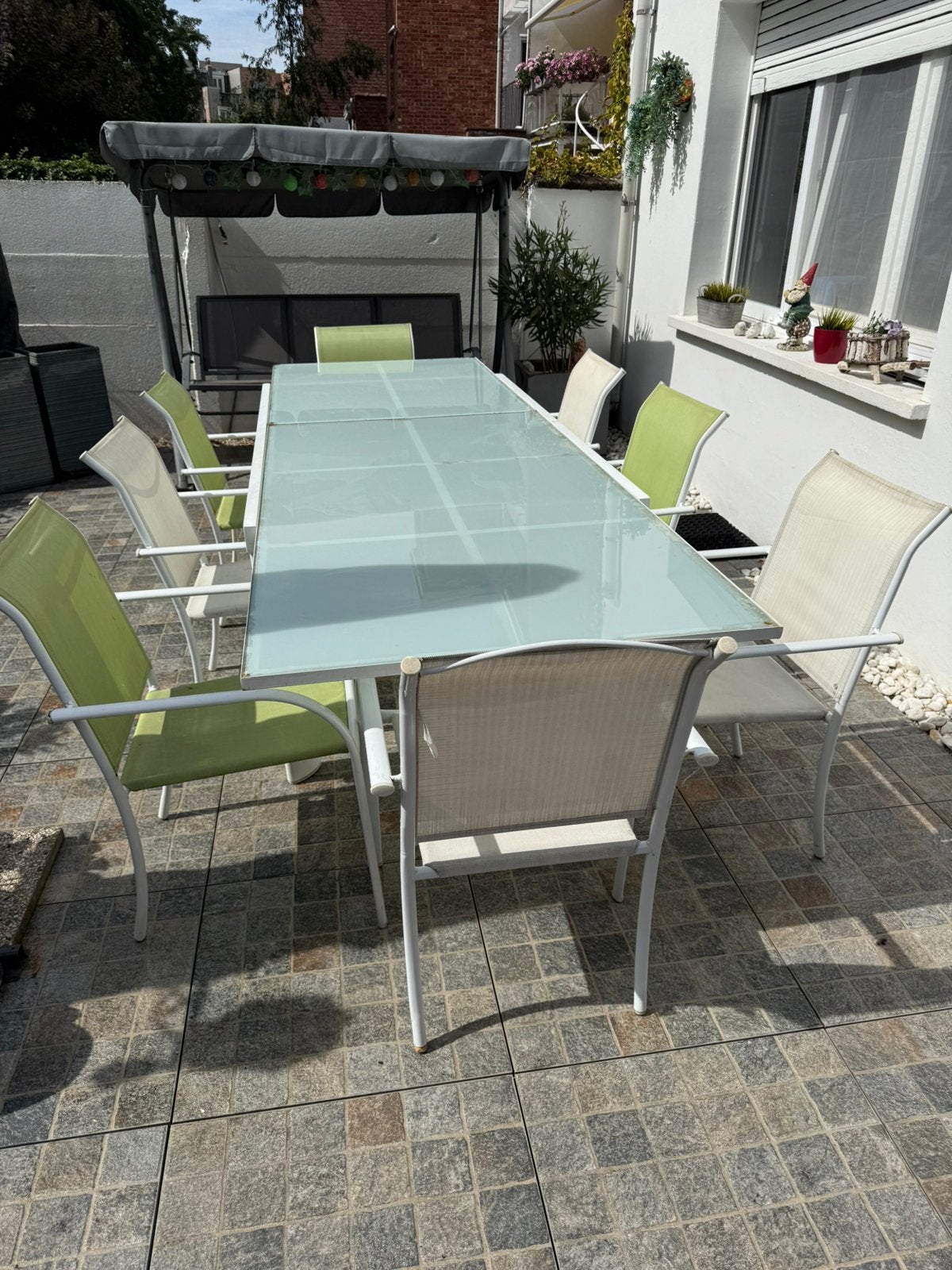 Glazen tuintafel+8 stoelen, Ophalen, Zo goed als nieuw