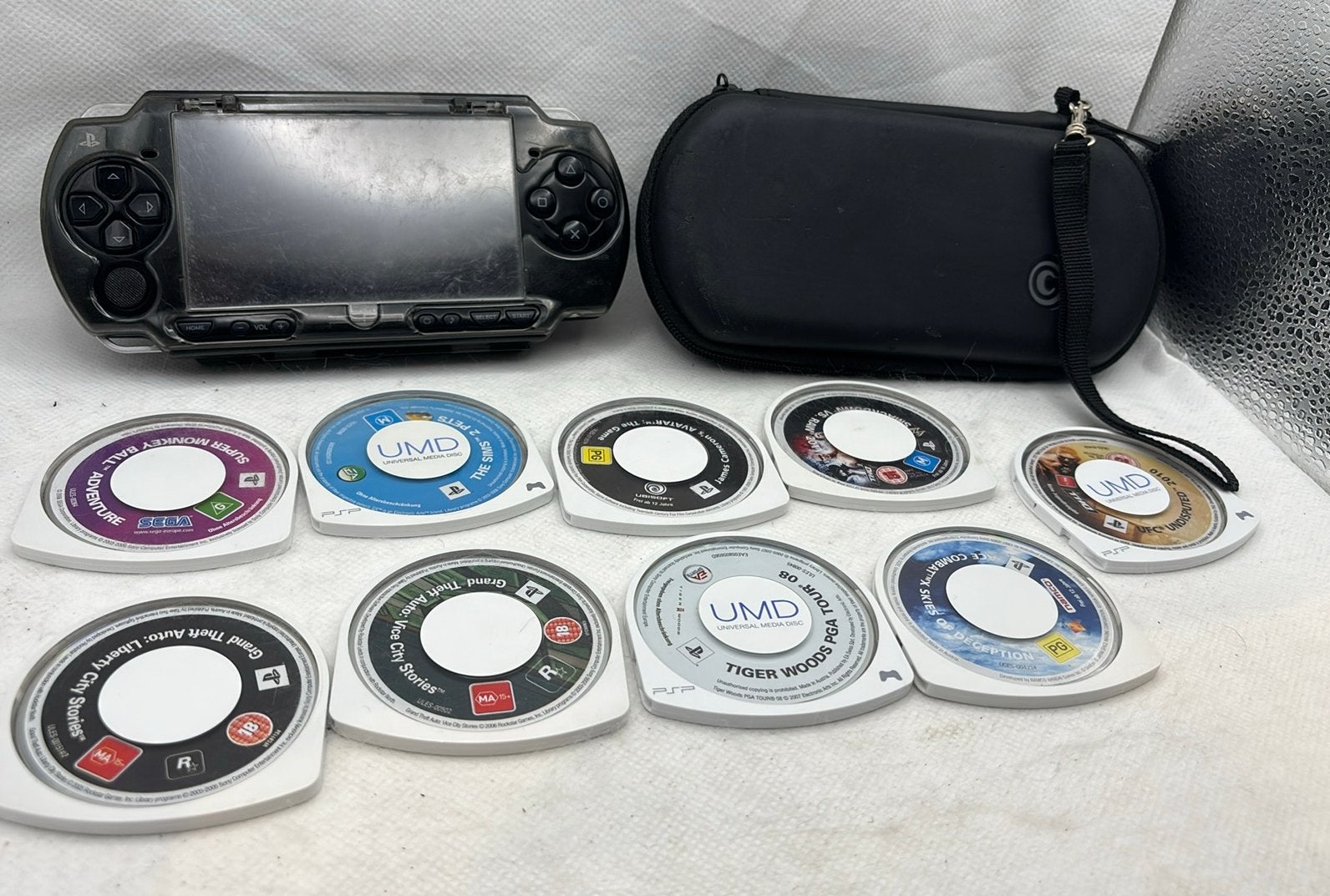 Sony PSP-2000 Slim Console-bundel + 9 UMD-games + hoesje, Ophalen of Verzenden, Gebruikt, PSP