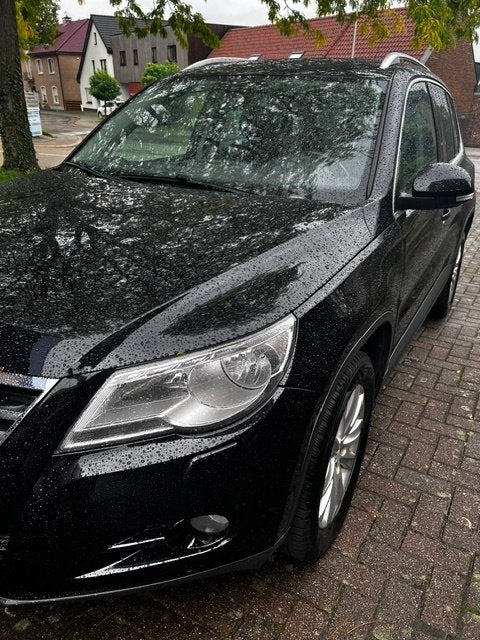 Volkswagen Tiguan Bouwjaar 2010, Auto's, Voorwielaandrijving, Euro 5, Stof, Zwart