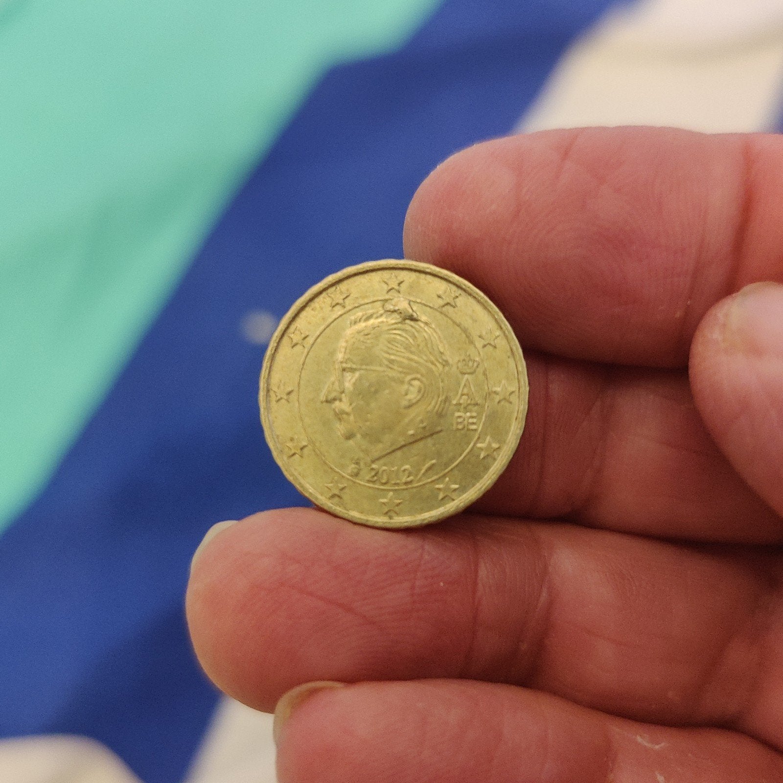 La pièce belge de 10 centimes de 2012 présente une petite im, Enlèvement, 10 centimes