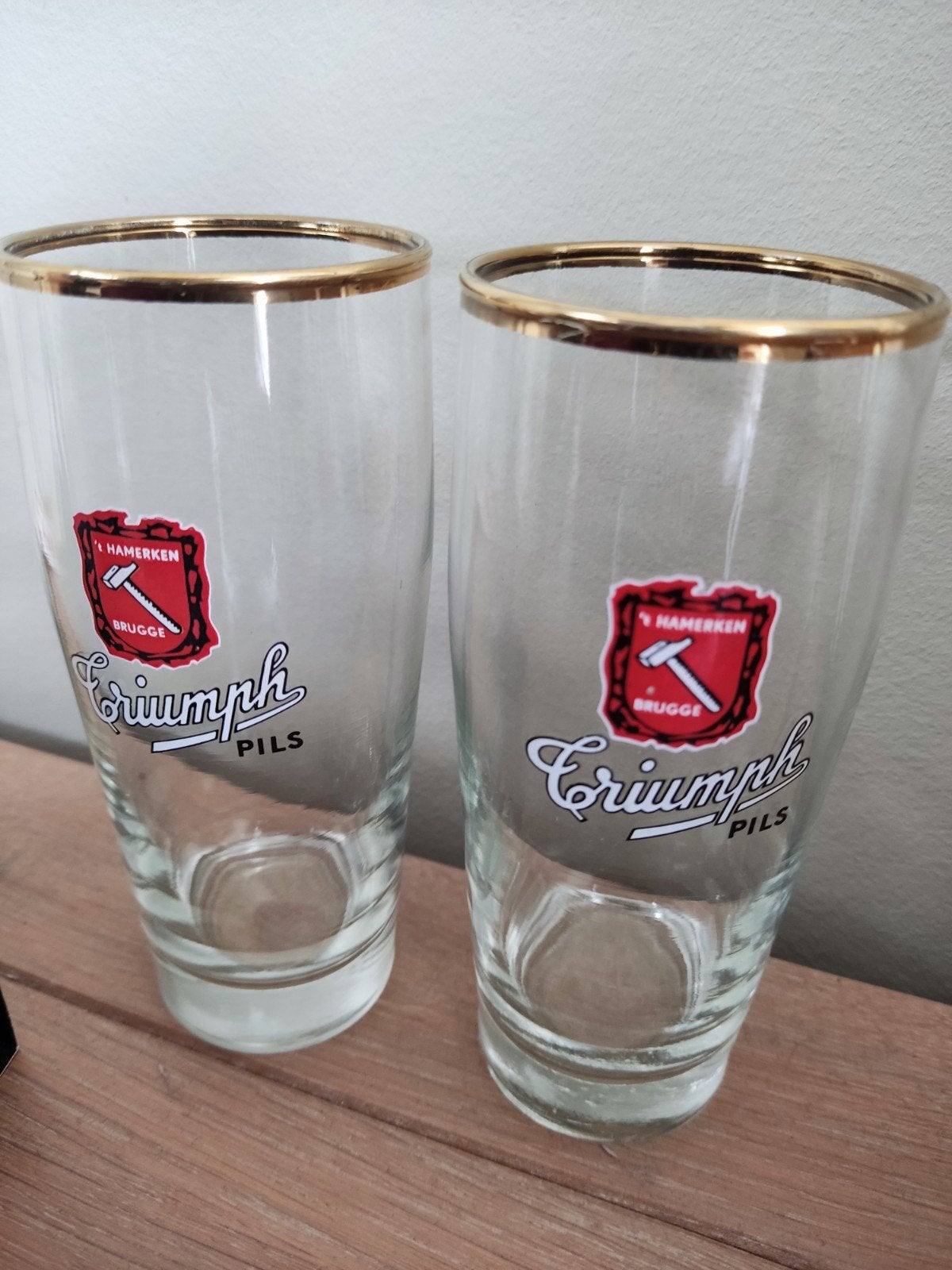 Set van 2 glazen Triumph pils 't hamerken, Verzamelen, Ophalen of Verzenden, Zo goed als nieuw, Bierglas