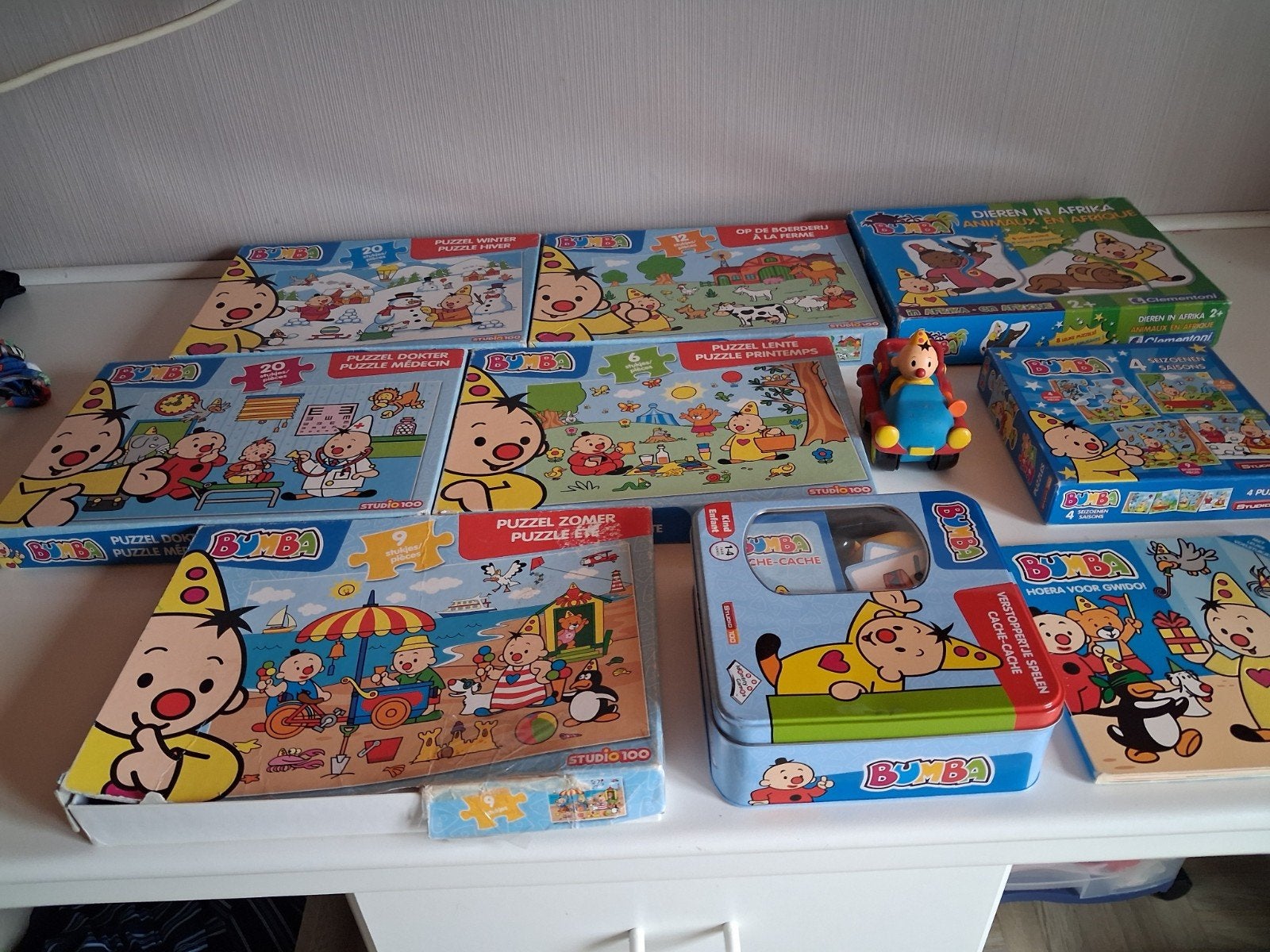 9 puzzels  van bumba en boekje en doos en auto goede staat, Ophalen