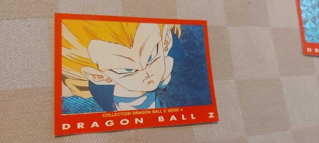 dragonball z kaart reverseholo shiny Gotenks fusion face, Ophalen of Verzenden, Nieuw, Losse kaart