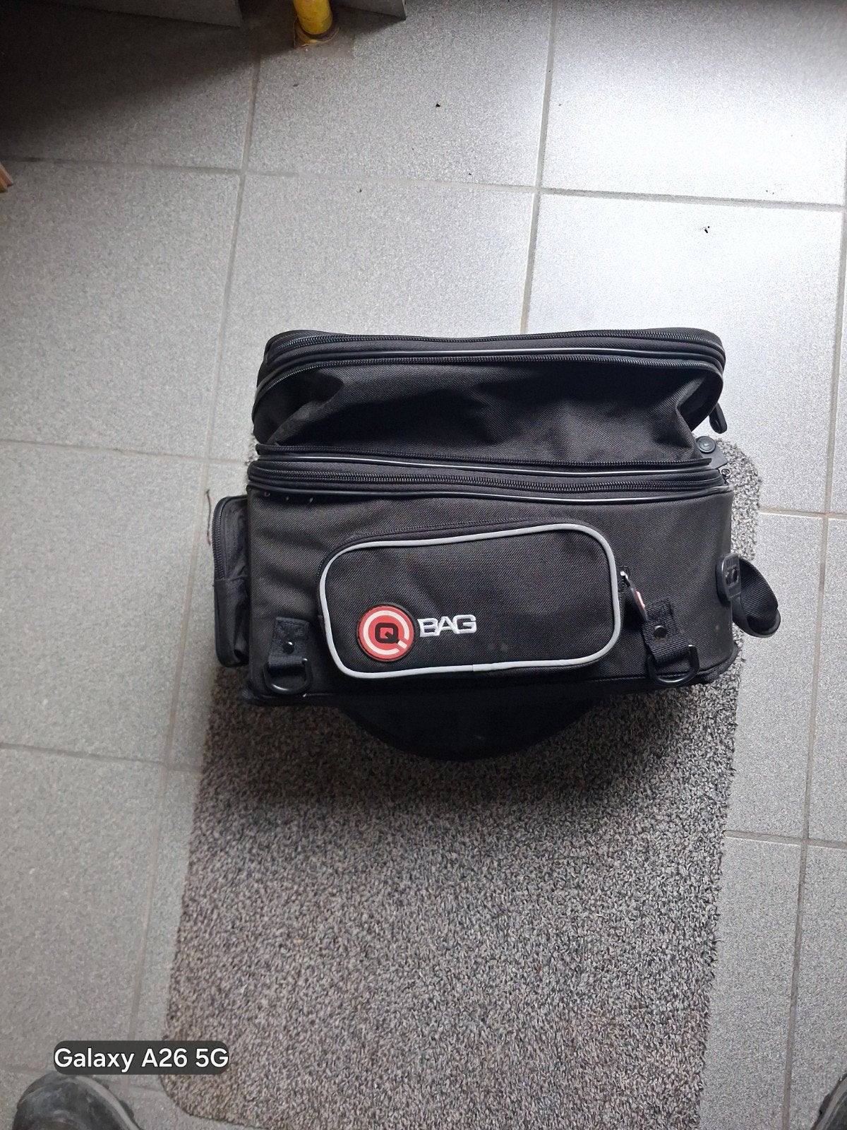 tanktas met magneet, Ophalen