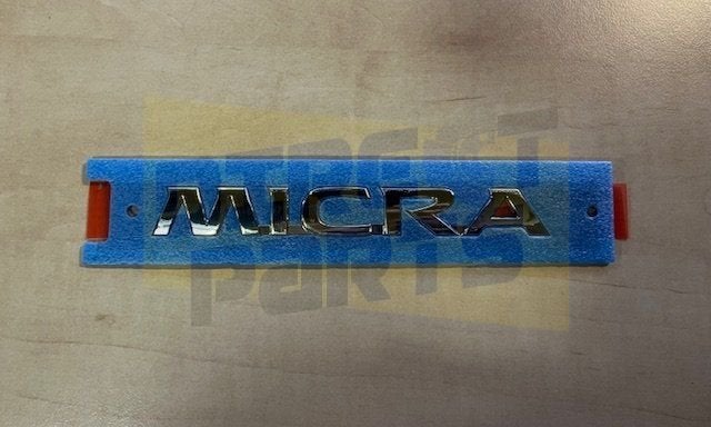 Nissan Micra (4/17-) (K14FR) embleem tekst ''Micra'' achterz, Autos : Pièces & Accessoires, Neuf, -, -, Nissan
