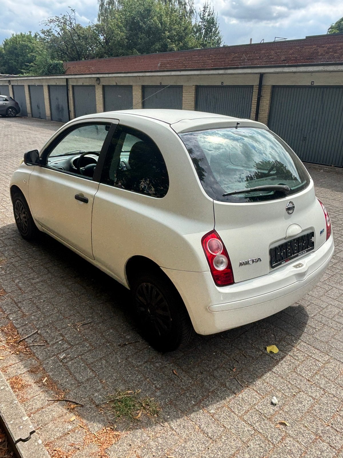nissan micra 2009, Auto's, Nissan, Voorwielaandrijving, Euro 5, Stof, Zwart