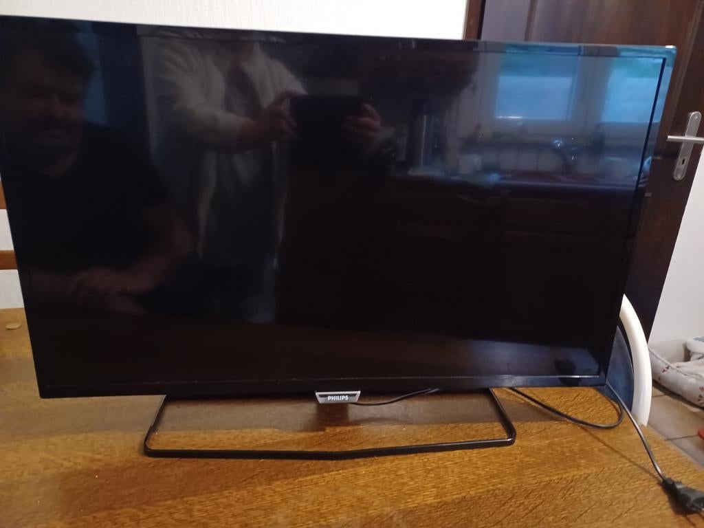 Philips tv met afstandbediening, Ophalen