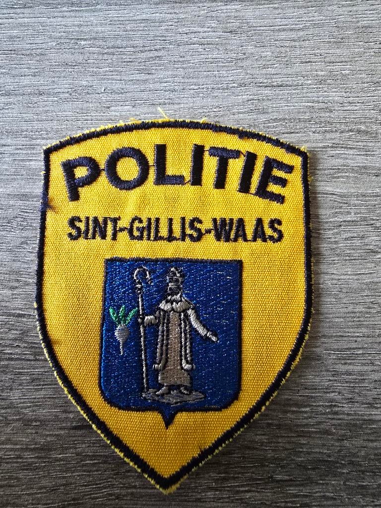 Écusson de police de Sint-Gillis-Waas, Enlèvement ou Envoi