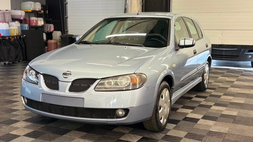 Nissan almera BENZINE bj2006 MANUEEL 198000KM 5DEURS, Auto's, Almera, 4 deurs, 1497 cc, Airbags