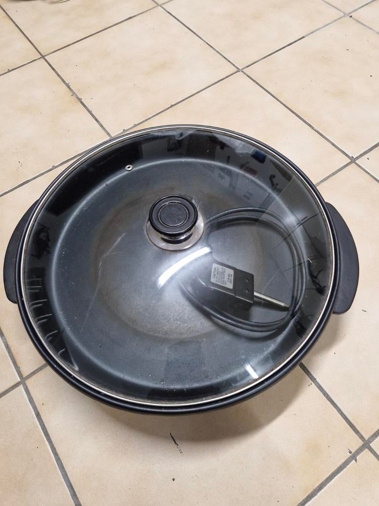 Paellapan op stroom, Ophalen