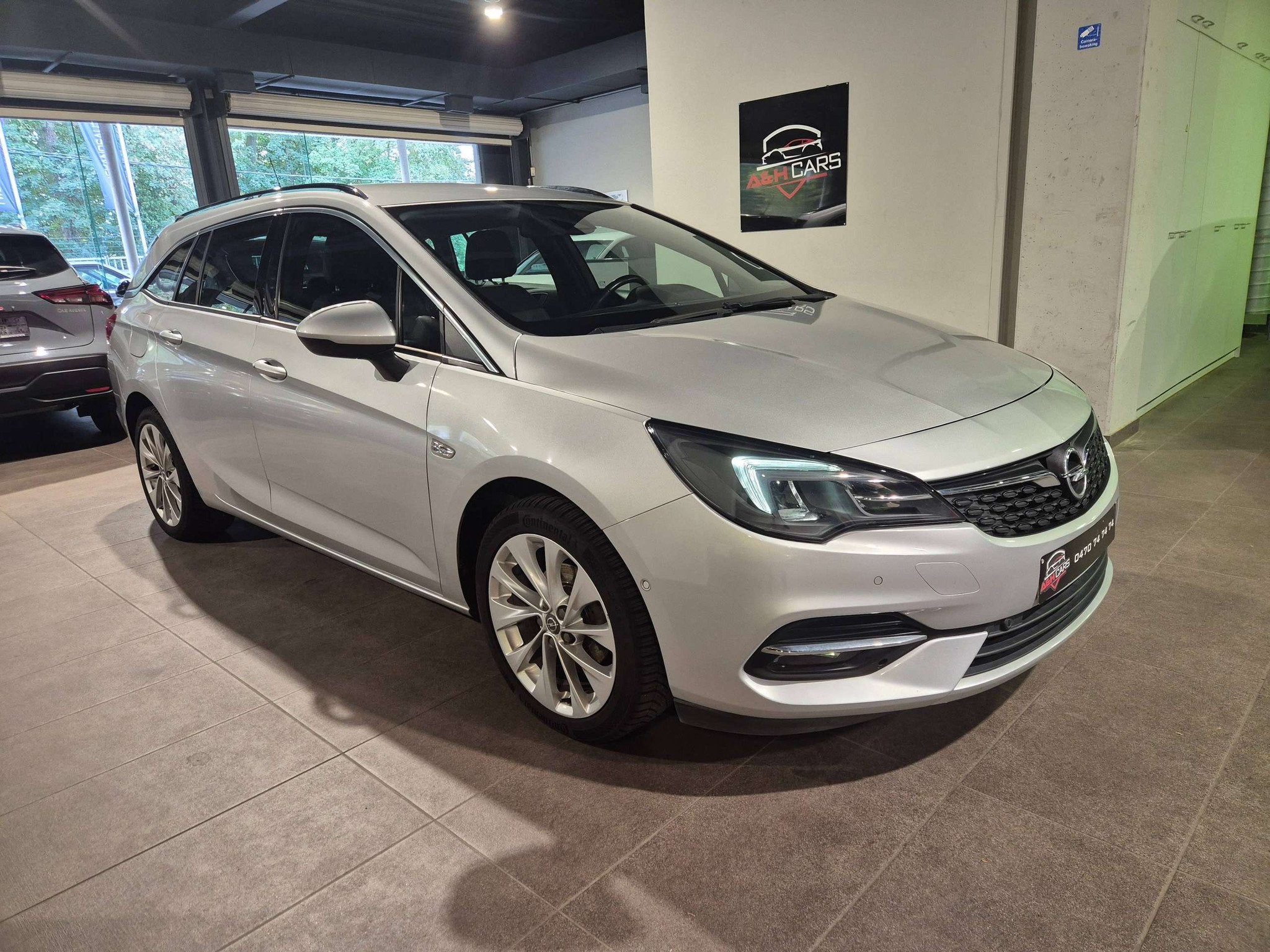Opel Astra Astra Sports Tourer 1.2 Turbo S/S (bj 2020), Auto's, Voorwielaandrijving, Stof, Gebruikt, Bedrijf