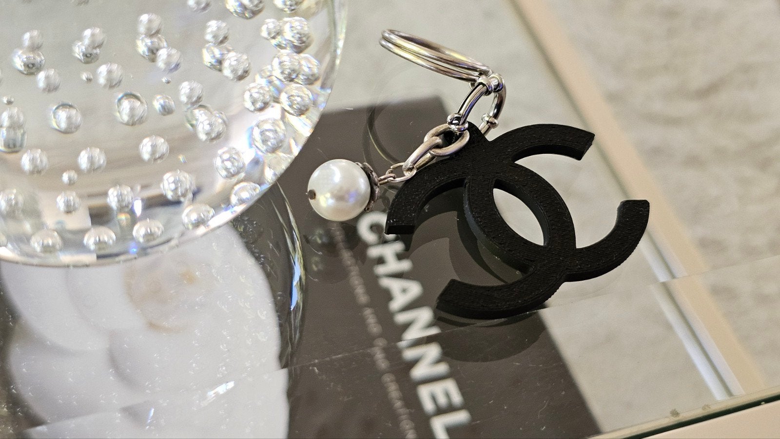 Design bag charm Coco met parel nieuw, sleutelhanger., Ophalen of Verzenden, Nieuw
