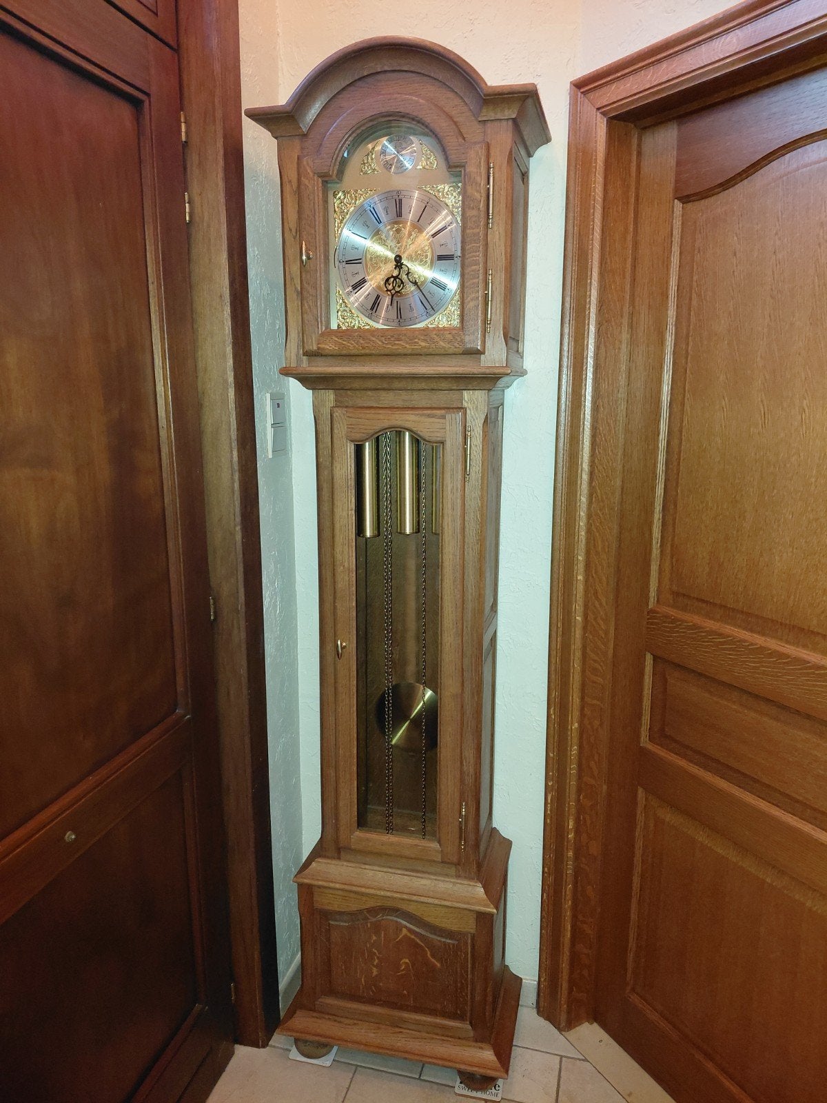Massieve eiken staanklok binnewerk interclock, Ophalen