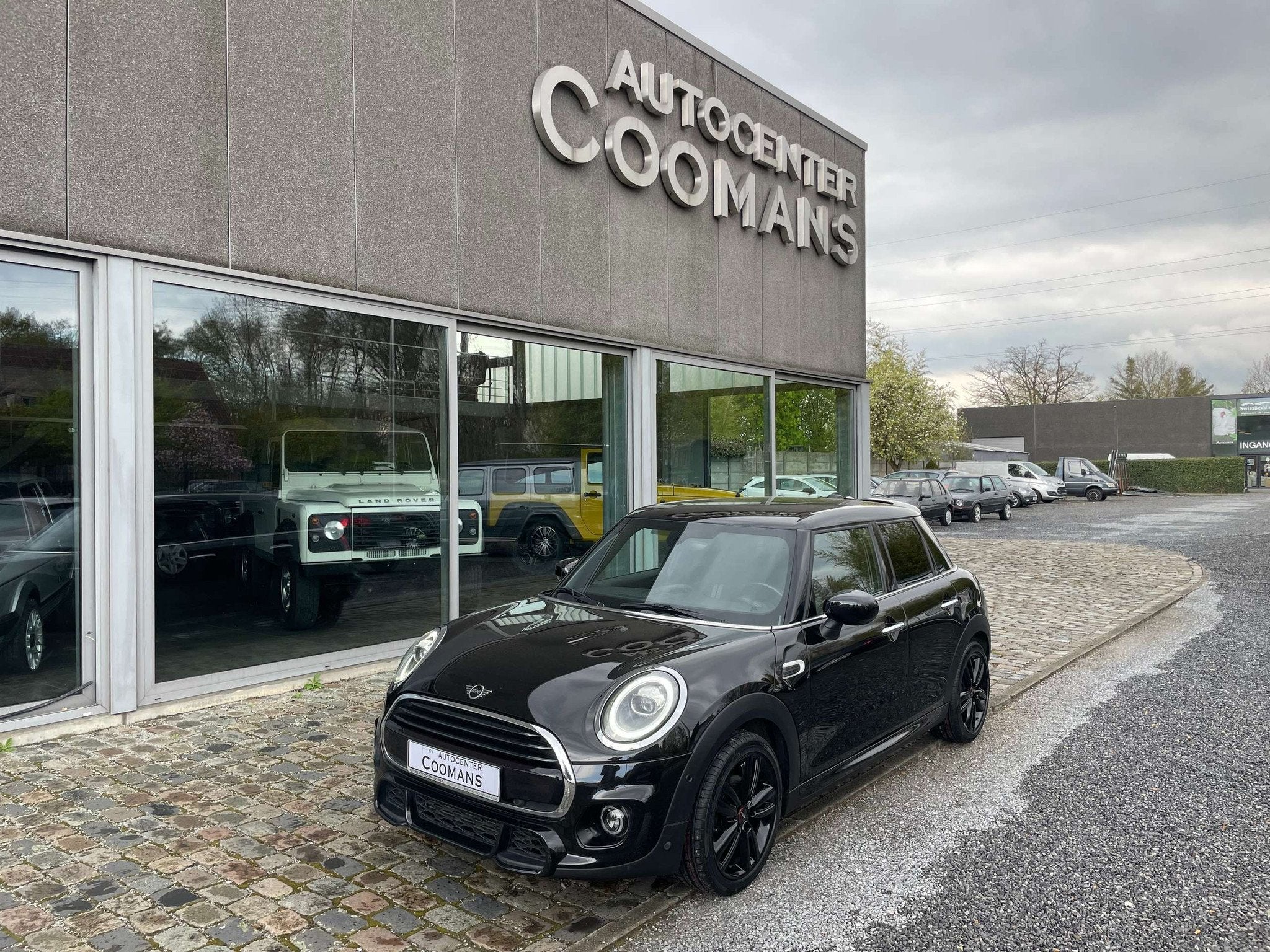 MINI Cooper 1.5 OPF (EU6d-TEMP) JWC (bj 2019), Stof, Gebruikt, 136 pk, Zwart