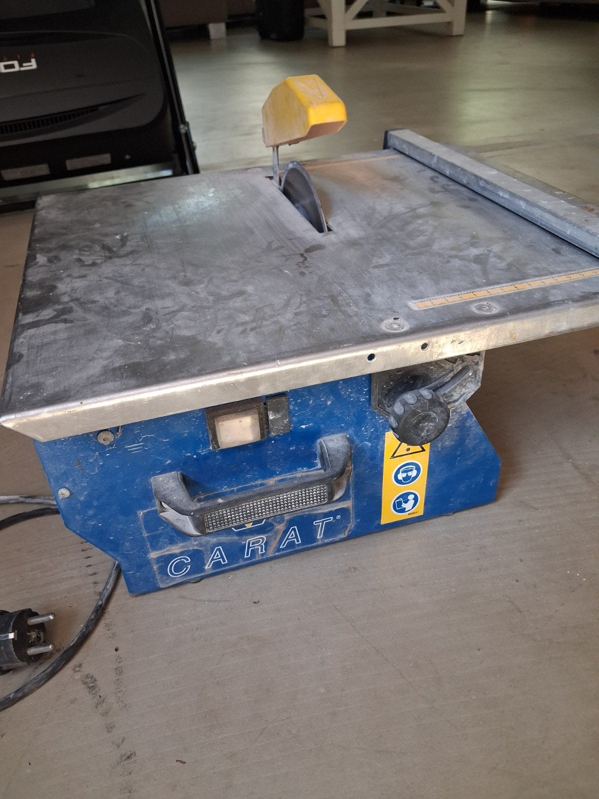 Tegelzaagmachine Carat, Ophalen