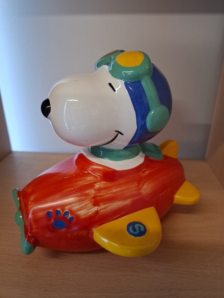 Snoopy spaarpot in vliegtuig - Peanuts United Feature, Enlèvement ou Envoi, Utilisé